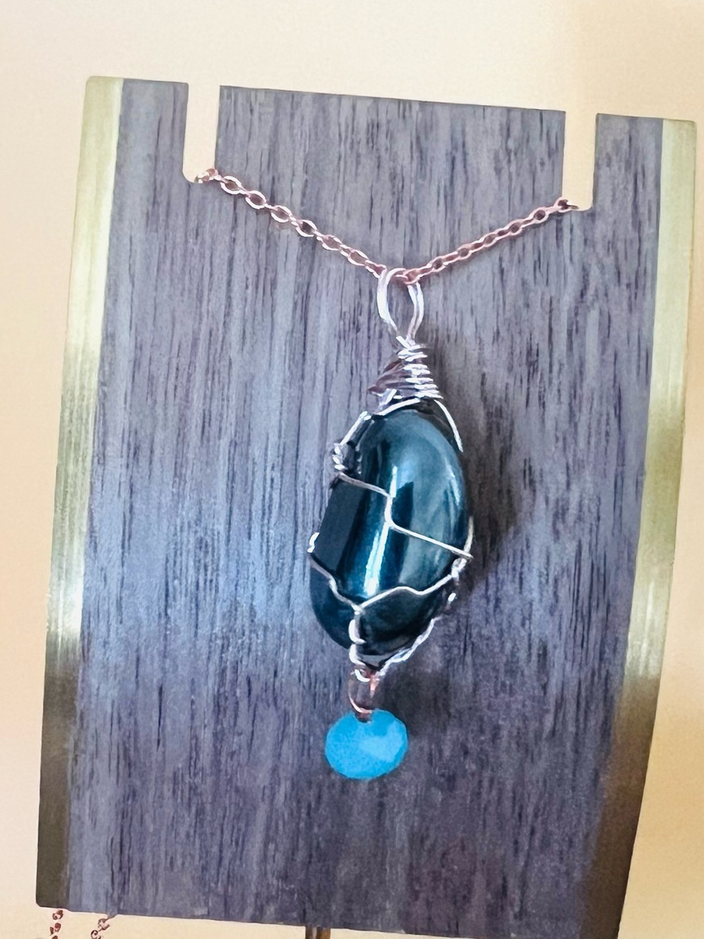 Rose gold plated wire wrapped oval onyx pendant
